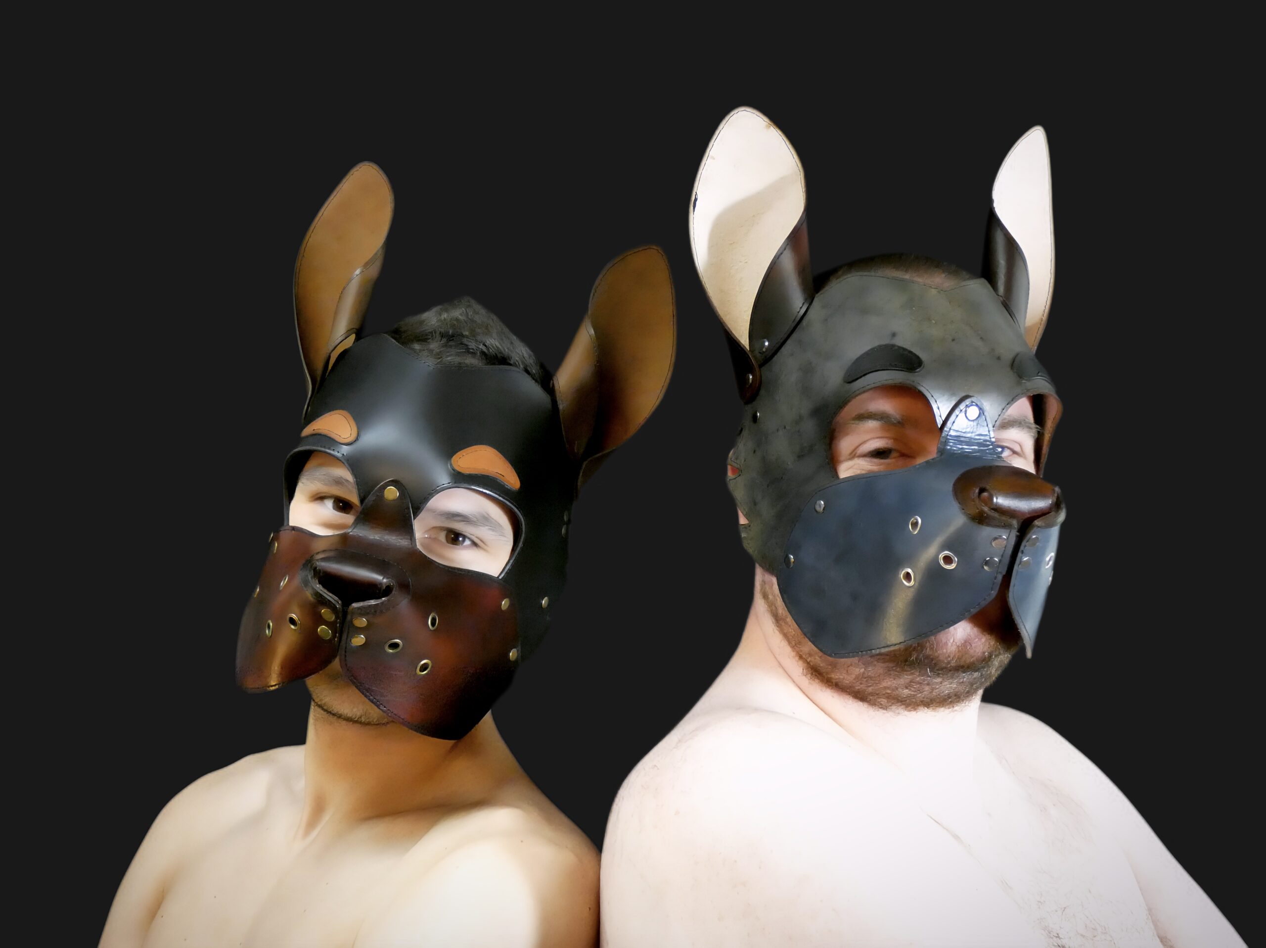 a couple of models showing off our UK made leather pup hoods